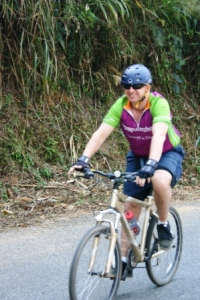 Craig cycling along the roads of Laos